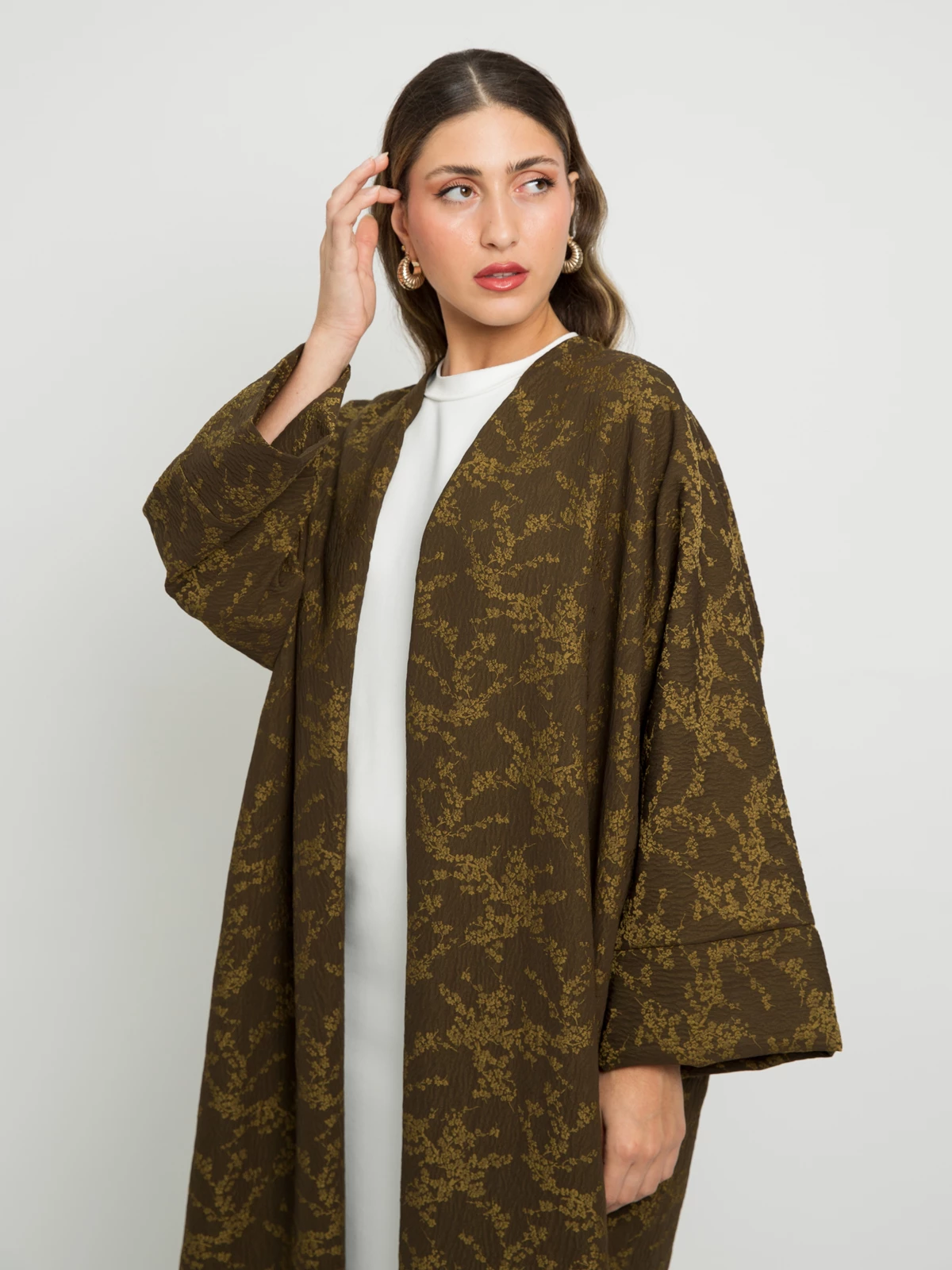 Olive open long fancy floral abaya with wide sleeves in Jacquard fabric by kaafmeem for events and occasions