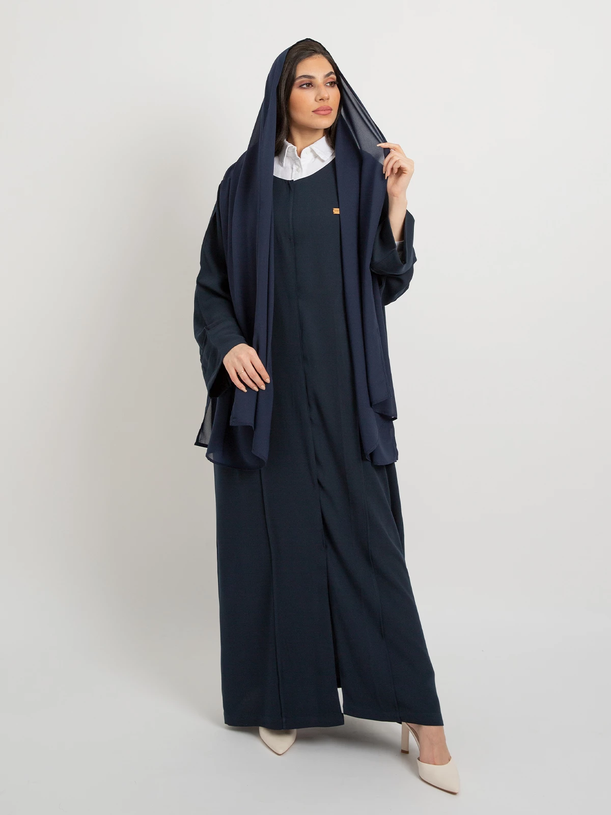 Navy closed practical abaya in crepe fabric with elegant sewing details by kaafmeem