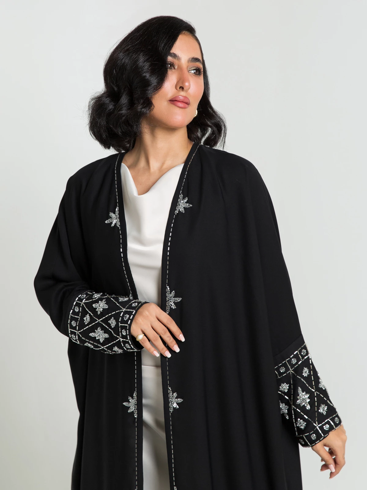 Black open long fancy beaded abaya with crystal flowers embroidery in high quality crepe fabric by kaafmeem