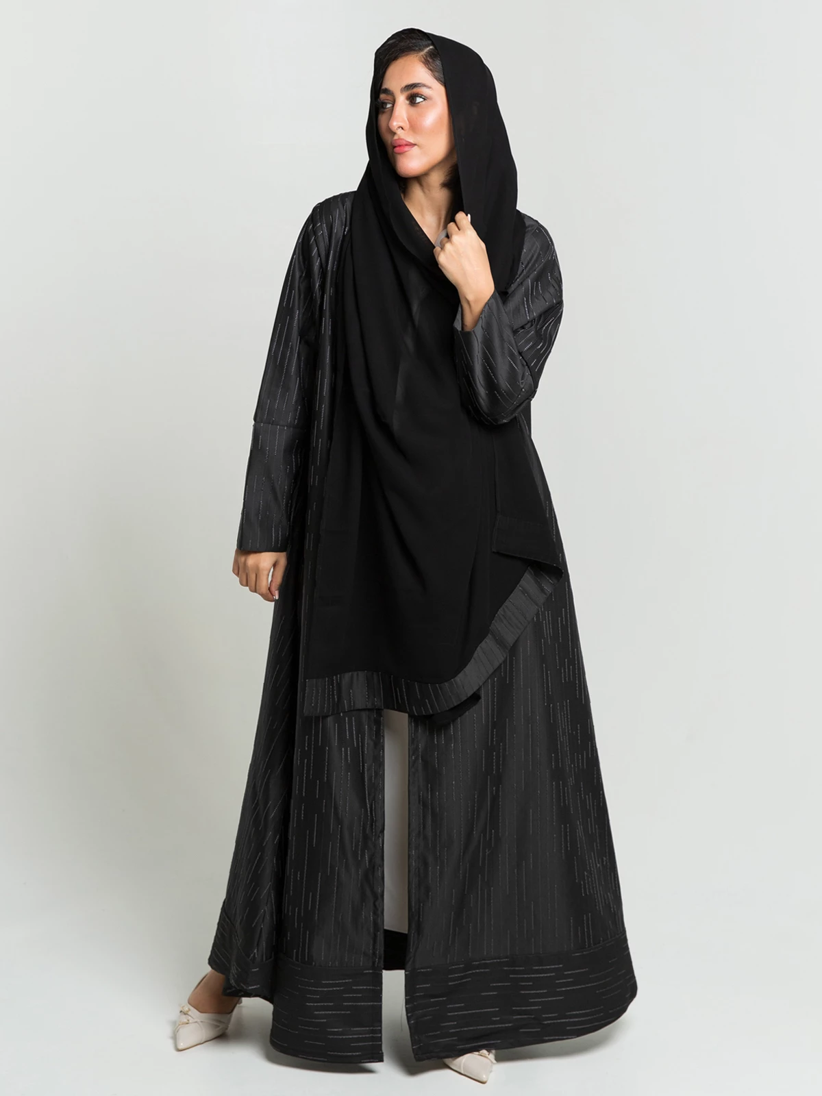 Black half cloche fancy embroidered abaya with tight sleeves in high quality jacquard fabric by kaafmeem for events