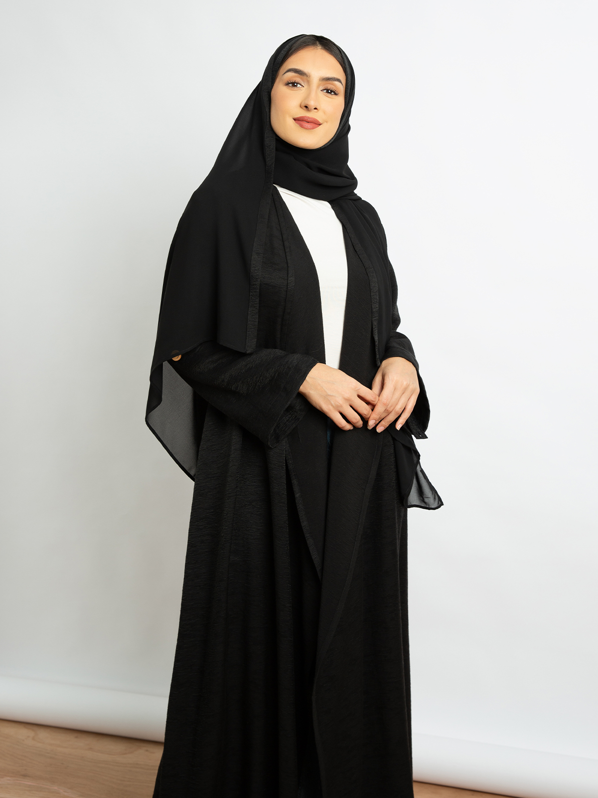 Open long wide cut comfy abaya with adjustable sleeves black color in linen-feel fabric for work and events by kaafmeem