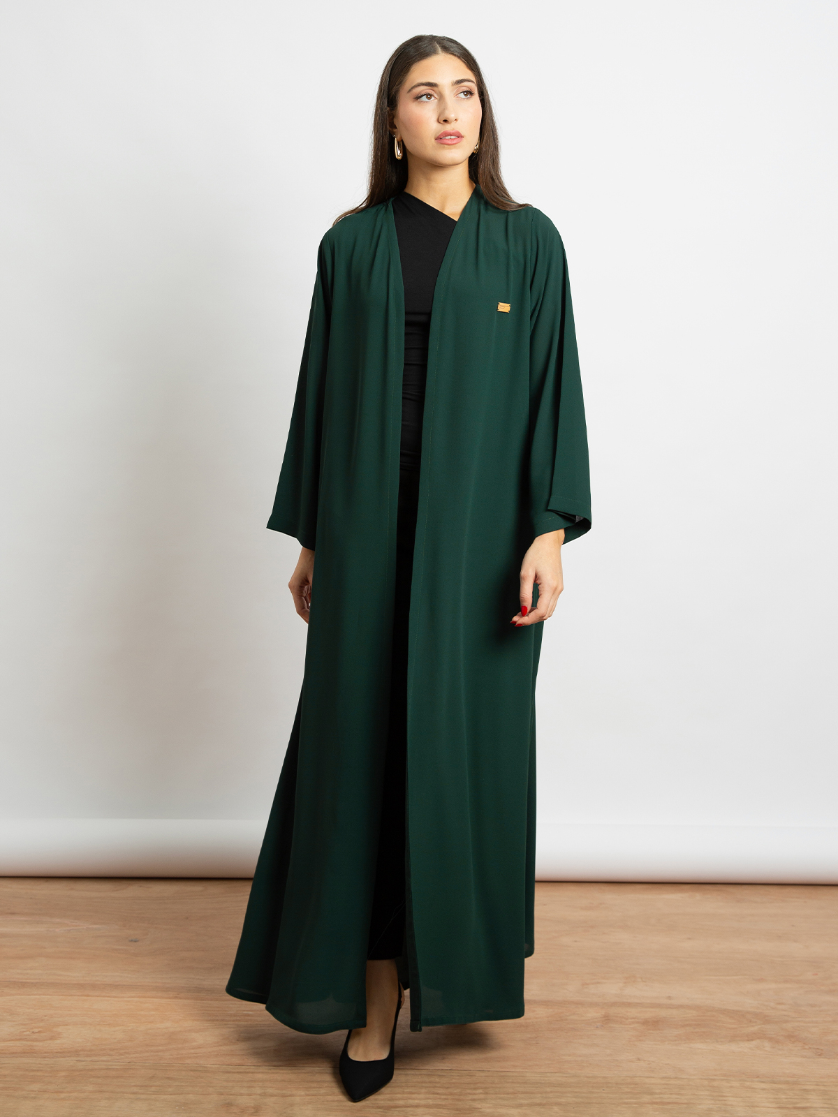 A cut long open half cloche abaya with matching tarha green color online for Saudi national day